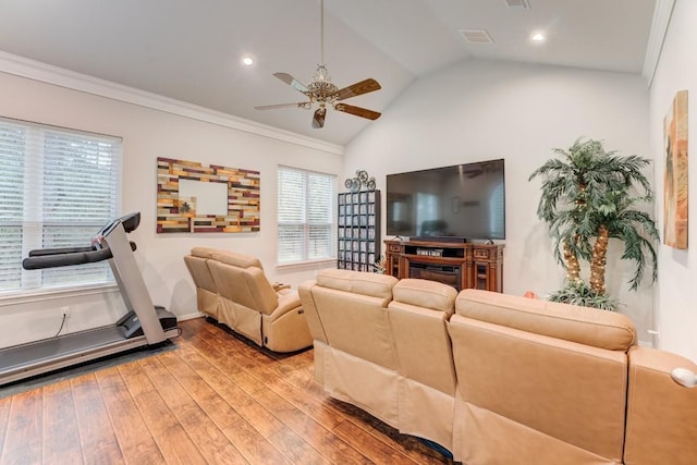 14904 Oak Shores Dr, Willis, TX 77318 - living area featuring ceiling fan, light wood finished floors, ornamental molding, vaulted ceiling, and recessed lighting