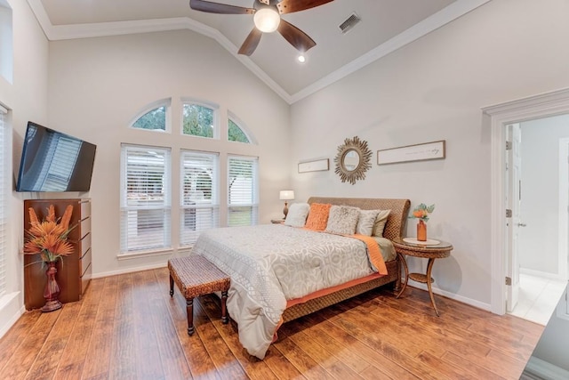 14904 Oak Shores Dr, Willis, TX 77318 - bedroom featuring ornamental molding, light wood-style floors, high vaulted ceiling, baseboards, and a ceiling fan