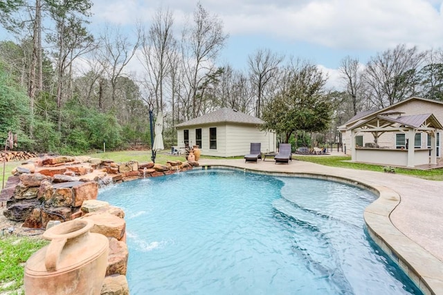 14904 Oak Shores Dr, Willis, TX 77318 - swimming pool with a patio and an outbuilding