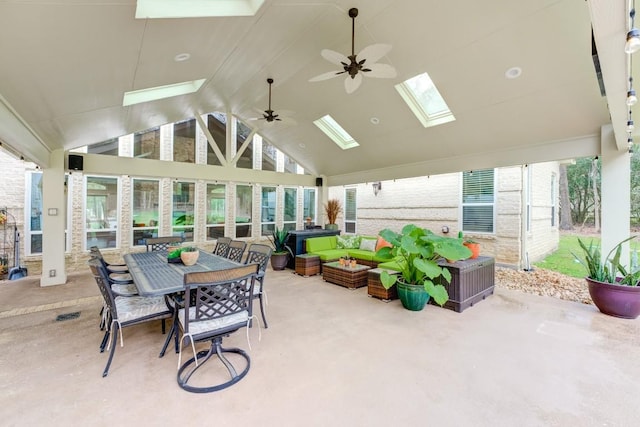 14904 Oak Shores Dr, Willis, TX 77318 - sunroom / solarium featuring a skylight, a ceiling fan, lofted ceiling, outdoor dining space, and an outdoor hangout area