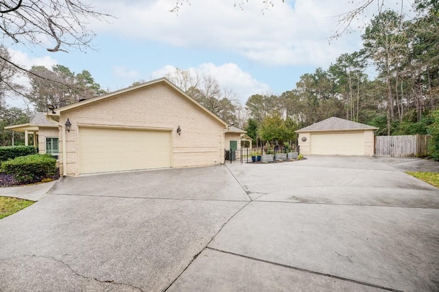 14904 Oak Shores Dr, Willis, TX 77318 - view of front of home featuring brick siding and a garage