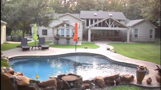 14904 Oak Shores Dr, Willis, TX 77318 - swimming pool featuring a patio area and a lawn