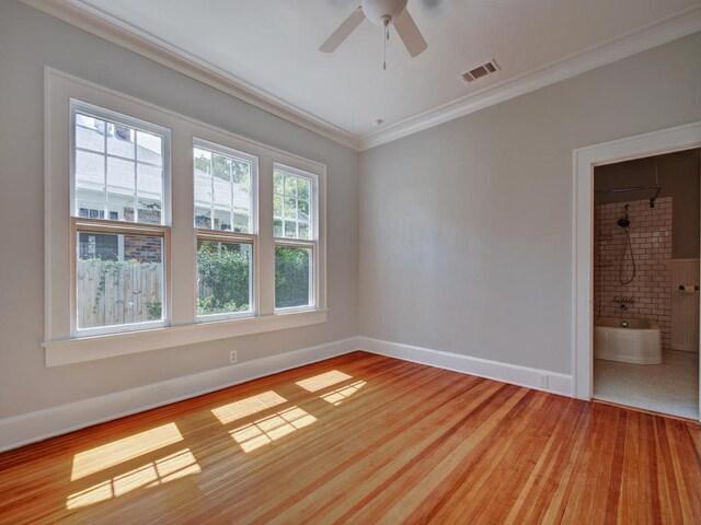 1203 W 22 1/2 St, Austin, TX 78705 - unfurnished room featuring ornamental molding, baseboards, ceiling fan, and light wood-type flooring