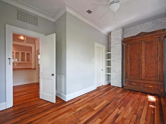 1203 W 22 1/2 St, Austin, TX 78705 - spare room with dark wood finished floors, crown molding, a ceiling fan, baseboards, and built in shelves