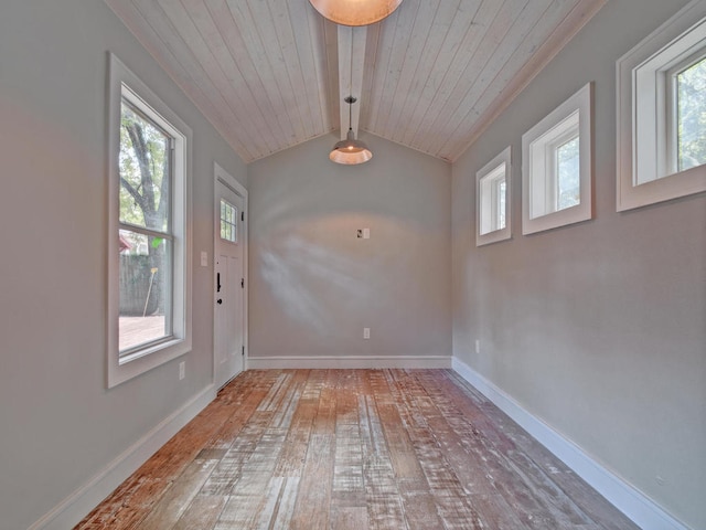 1203 W 22 1/2 St, Austin, TX 78705 - unfurnished dining area with hardwood / wood-style flooring, baseboards, and wooden ceiling