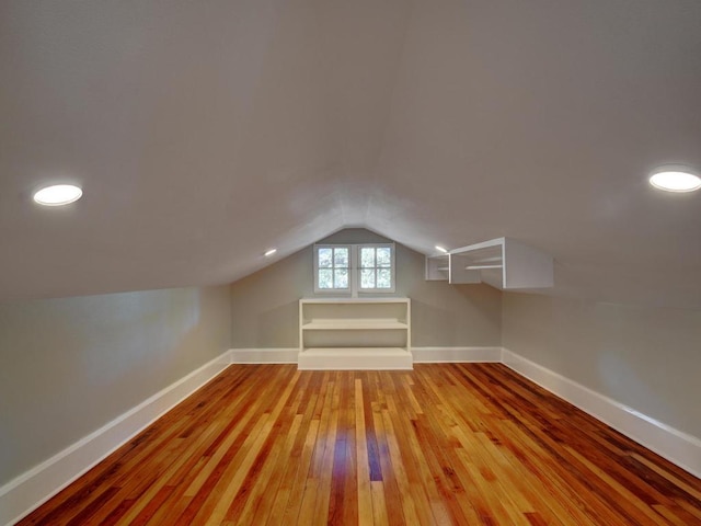 1203 W 22 1/2 St, Austin, TX 78705 - bonus room with vaulted ceiling, baseboards, and hardwood / wood-style floors