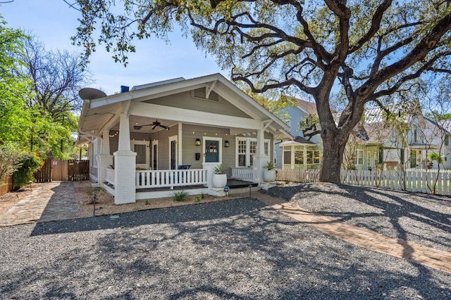 1203 W 22 1/2 St, Austin, TX 78705 - shotgun-style home featuring a porch, ceiling fan, and fence