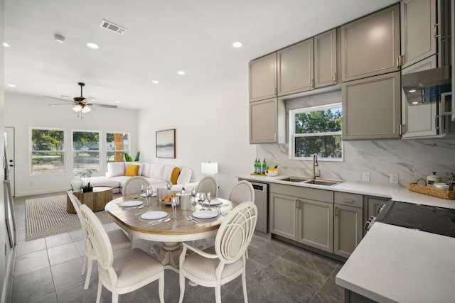 dining area with dark tile patterned floors, recessed lighting, visible vents, and ceiling fan