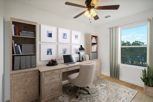 office space featuring visible vents, baseboards, ceiling fan, and wood finished floors