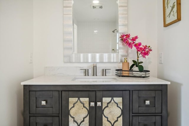 bathroom with vanity and visible vents