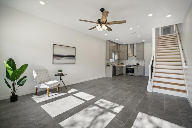 unfurnished living room featuring stairway, recessed lighting, baseboards, and a ceiling fan
