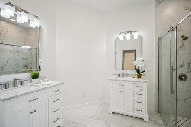 bathroom with a marble finish shower, marble finish floor, baseboards, and a sink