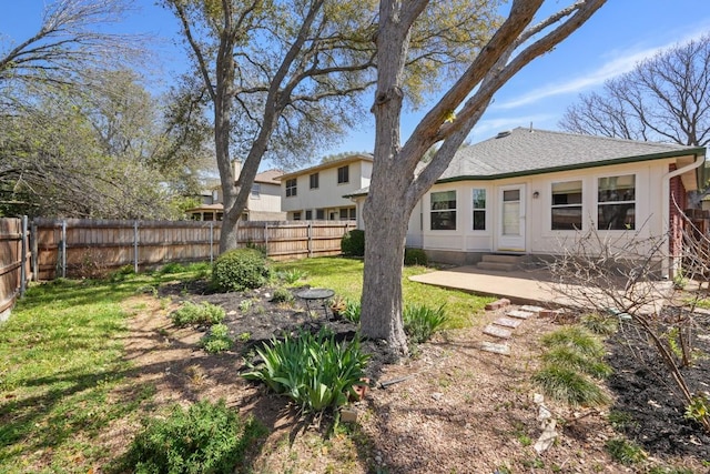 9408 Notches Dr, Austin, TX 78748 - back of house featuring a patio, a fenced backyard, a shingled roof, and a yard