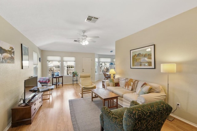 9408 Notches Dr, Austin, TX 78748 - living room featuring light wood finished floors, a ceiling fan, visible vents, and baseboards