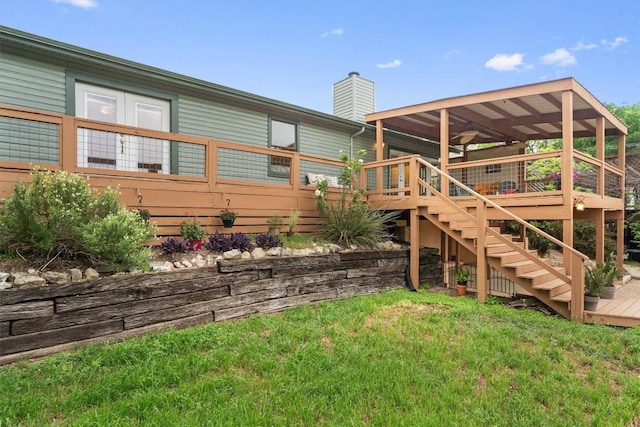 4004 Highland Dr, Austin, TX 78734 - back of property featuring a chimney, stairs, a wooden deck, and a lawn