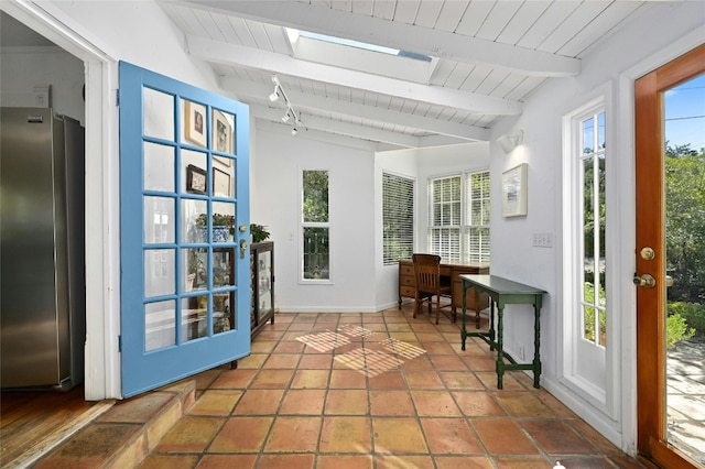 167 N Tumbleweed Trl, Austin, TX 78733 - sunroom featuring a wealth of natural light, beam ceiling, and a skylight
