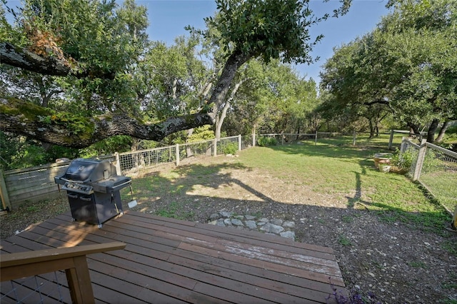 167 N Tumbleweed Trl, Austin, TX 78733 - wooden deck featuring a fenced backyard, a grill, and a yard