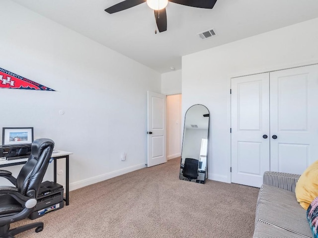110 Pigeon River Rd, Kyle, TX 78640 - home office featuring a ceiling fan, carpet flooring, and baseboards