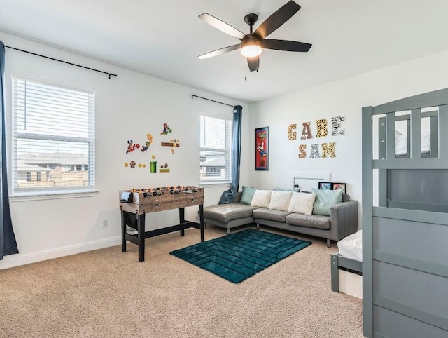 110 Pigeon River Rd, Kyle, TX 78640 - living room featuring carpet, a ceiling fan, and baseboards