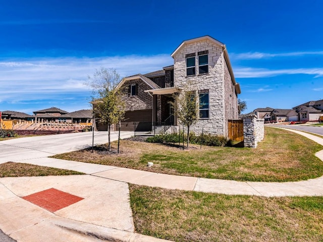 110 Pigeon River Rd, Kyle, TX 78640 - view of front of home with stone siding, concrete driveway, a residential view, and a garage