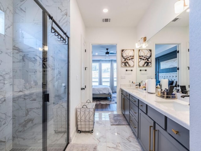 110 Pigeon River Rd, Kyle, TX 78640 - ensuite bathroom featuring marble tiled floors, double vanity, and a marble finish shower
