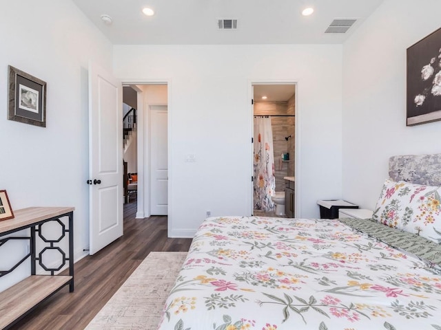 110 Pigeon River Rd, Kyle, TX 78640 - bedroom with dark wood finished floors, recessed lighting, baseboards, and connected bathroom