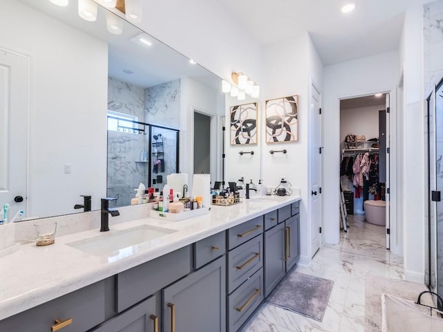 110 Pigeon River Rd, Kyle, TX 78640 - full bathroom with double vanity, a walk in closet, a shower stall, marble finish flooring, and recessed lighting