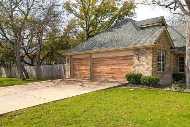 30228 Saint Andrews Dr, Georgetown, TX 78628 - view of property exterior with driveway, a garage, roof with shingles, and brick siding
