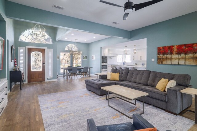 30228 Saint Andrews Dr, Georgetown, TX 78628 - living area with a chandelier, wood finished floors, a ceiling fan, and recessed lighting