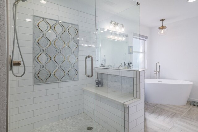 30228 Saint Andrews Dr, Georgetown, TX 78628 - bathroom with a stall shower and a freestanding bath