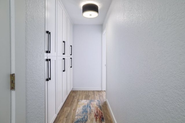 30228 Saint Andrews Dr, Georgetown, TX 78628 - hall featuring light wood finished floors and a textured wall