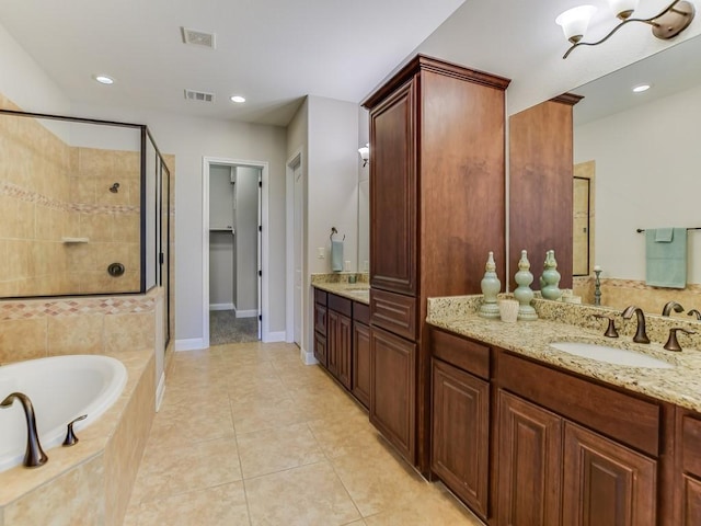 15218 Glen Heather Dr, Lakeway, TX 78734 - bathroom with a stall shower, double vanity, a bath, tile patterned floors, and recessed lighting