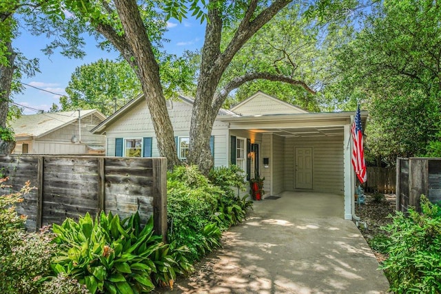 4010 Lewis Ln, Austin, TX 78756 - view of front of house featuring an attached carport and concrete driveway