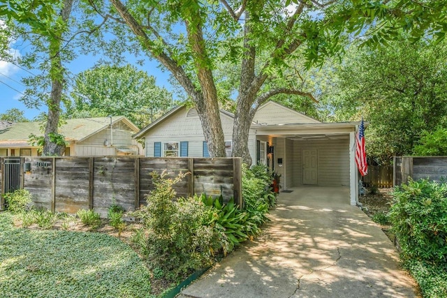 4010 Lewis Ln, Austin, TX 78756 - view of front facade with concrete driveway and a carport