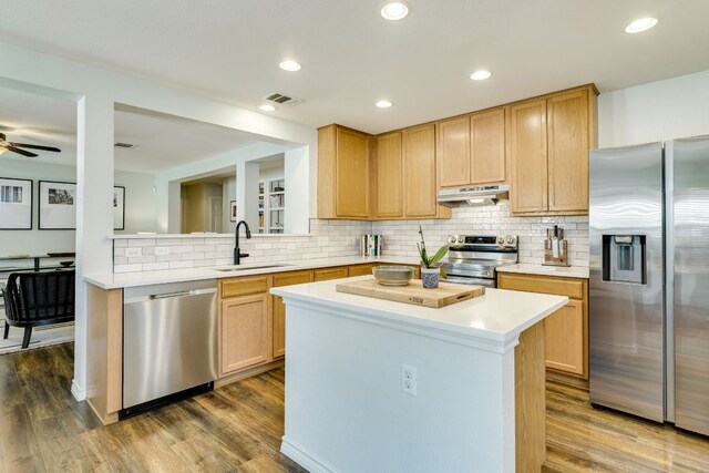 837 Watson Way, Pflugerville, TX 78660 - kitchen with stainless steel appliances, under cabinet range hood, dark wood finished floors, light countertops, and recessed lighting