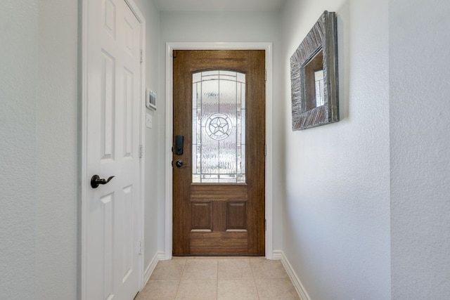 837 Watson Way, Pflugerville, TX 78660 - doorway to outside featuring baseboards and light tile patterned flooring