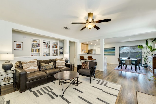 837 Watson Way, Pflugerville, TX 78660 - living area with ceiling fan, light wood-style flooring, and built in features