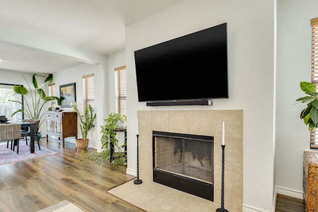 837 Watson Way, Pflugerville, TX 78660 - living area featuring wood finished floors and a tile fireplace