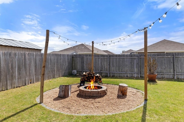 410 Seneca Loop, Kyle, TX 78640 - view of yard with an outdoor fire pit and a fenced backyard