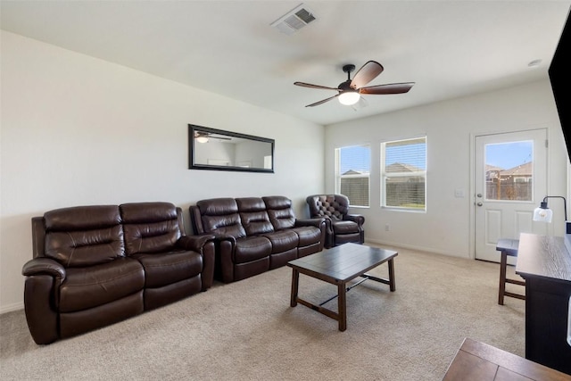410 Seneca Loop, Kyle, TX 78640 - living room with visible vents, light colored carpet, baseboards, and ceiling fan