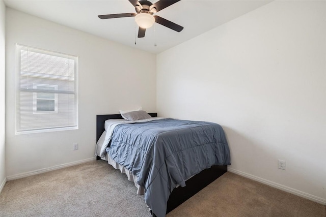 410 Seneca Loop, Kyle, TX 78640 - carpeted bedroom with ceiling fan and baseboards