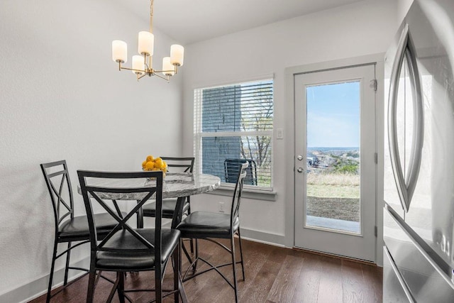 2256 Local Rebel Loop, Leander, TX 78641 - dining area featuring a chandelier and dark wood-style floors