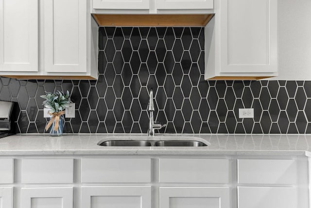 2256 Local Rebel Loop, Leander, TX 78641 - kitchen with white cabinetry and tasteful backsplash