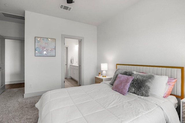 2256 Local Rebel Loop, Leander, TX 78641 - carpeted bedroom with baseboards and ensuite bathroom