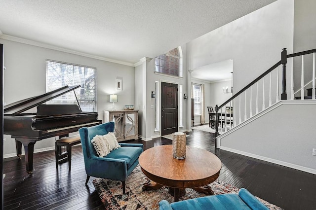 foyer entrance with wood-type flooring, stairway, and baseboards
