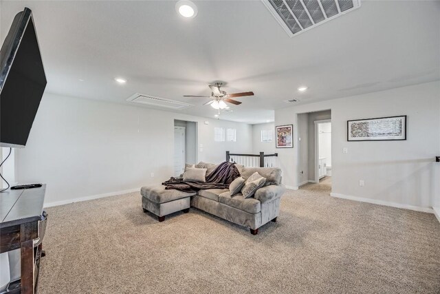 329 Peace Pipe Way, Georgetown, TX 78628 - living room with attic access, light colored carpet, ceiling fan, recessed lighting, and baseboards