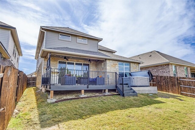 329 Peace Pipe Way, Georgetown, TX 78628 - rear view of property featuring stone siding, ceiling fan, a wooden deck, and roof with shingles