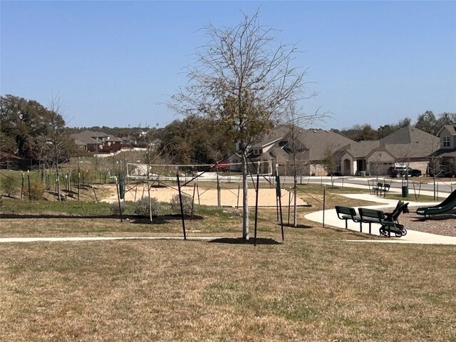 329 Peace Pipe Way, Georgetown, TX 78628 - view of community with a lawn and a residential view