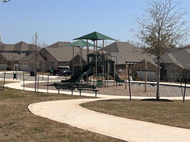 329 Peace Pipe Way, Georgetown, TX 78628 - community play area featuring a residential view