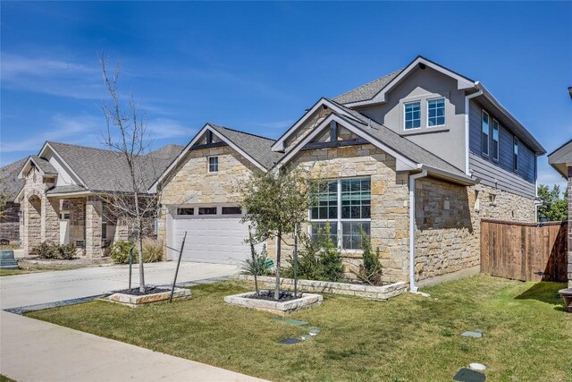 329 Peace Pipe Way, Georgetown, TX 78628 - view of front facade with stone siding, concrete driveway, and a garage